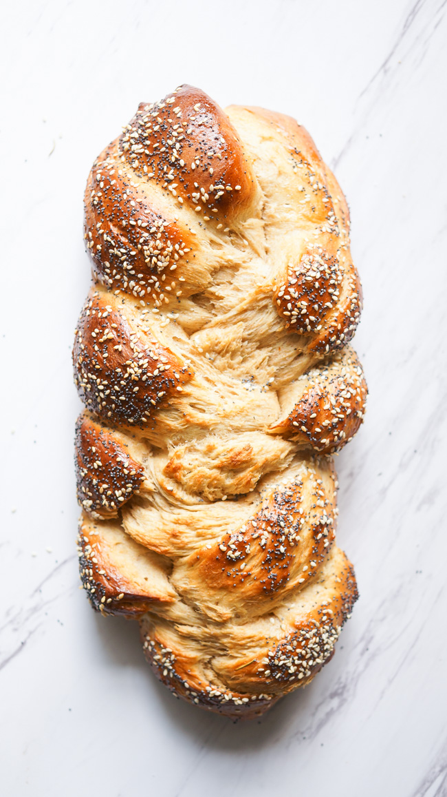 Braided Herb Challah. A soft and sweet bread with savory herbs braided into a beautiful loaf! 