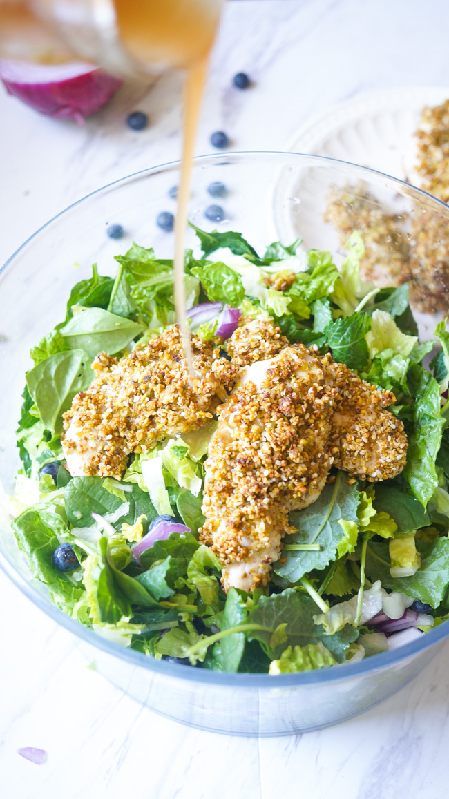 This Pistachio Crusted Chicken Salad is full of flavor! Packed with nuts, blueberries, and healthy greens, you won't want to stop eating!