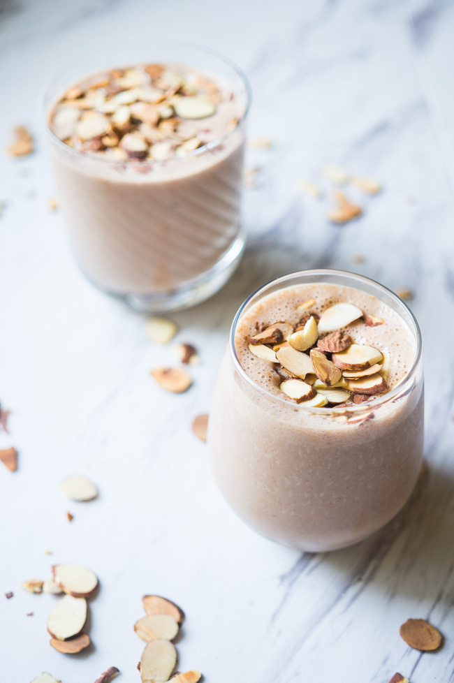 Coconut Banana Smoothie with toasted almonds, peanut butter, and honey! So creamy and delicious.