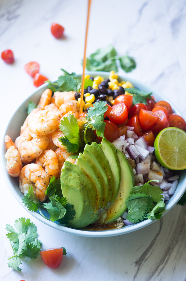 Garlic Lime Shrimp & Quinoa Salad. A zesty, nutrient dense salad that will wow your guests with its amazing fresh flavors! 