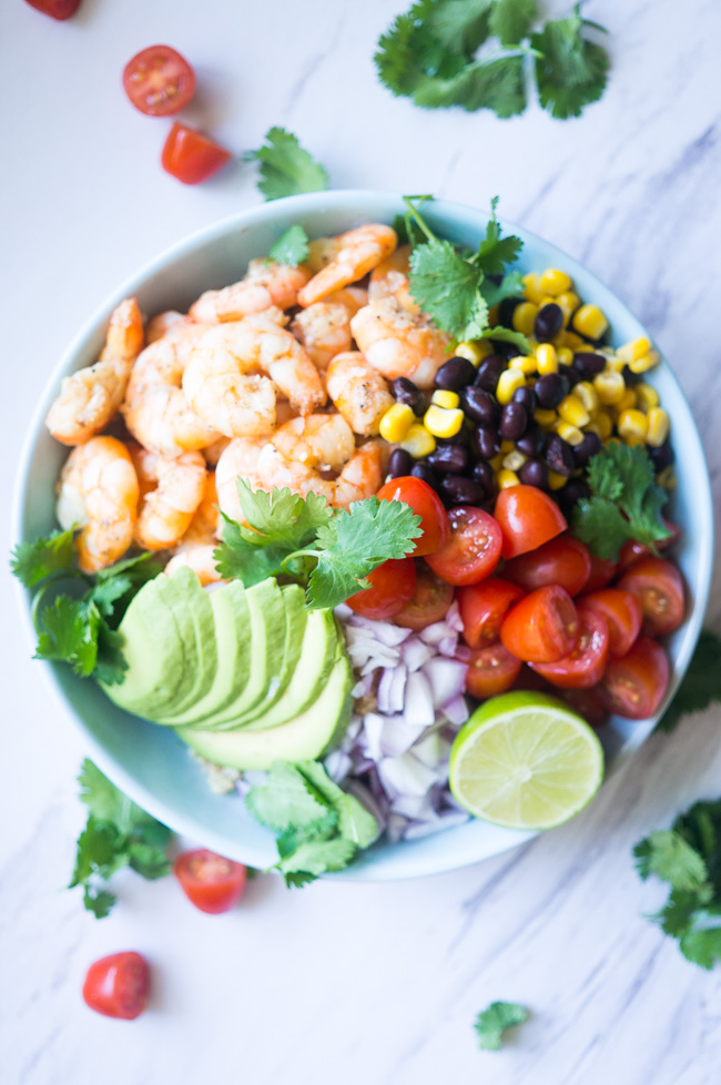 Garlic Lime Shrimp & Quinoa Salad. A zesty, nutrient dense salad that will wow your guests with its amazing fresh flavors! 