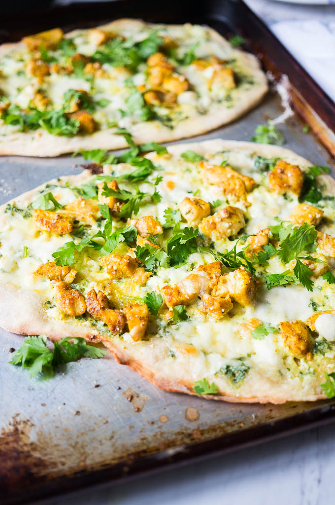 Bombay Chicken Flatbread. An indian inspired pizza with cilantro cream, aromatic chicken, and award winning flatbread. 