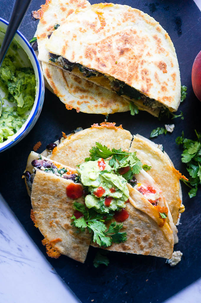 Breakfast Black Bean and Egg Quesadillas. A hearty, protein packed breakfast that will kick start your day with it's fresh ingredients and bold flavors!