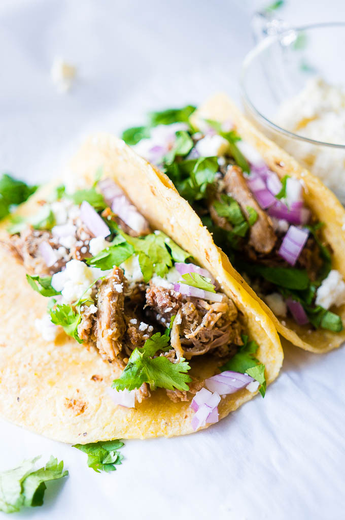 Pressure Cooker Green Chile Pork Carnitas. Moist, flavor-packed, and fall apart in your mouth tender, these green chili pork tacos are the perfect solution for a speedy family friendly dinner!