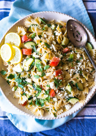 Colorful pasta salad on a blue napkin.