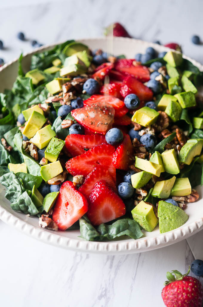 Summer Spinach and Berry Salad with Lemon Chia Vinaigrette. A refreshing summer salad with the bright flavors of fresh berries, lemon zest, cool avocado, and dark leafy greens.