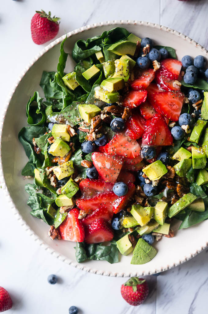 Summer Spinach and Berry Salad with Lemon Chia Vinaigrette. A refreshing summer salad with the bright flavors of fresh berries, lemon zest, cool avocado, and dark leafy greens.