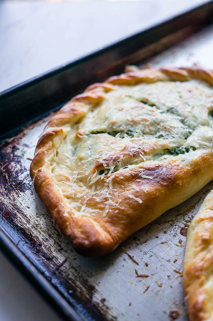 Ricotta and Spinach Calzones. A cheesy vegetarian calzone to substitute into your pizza routine! 