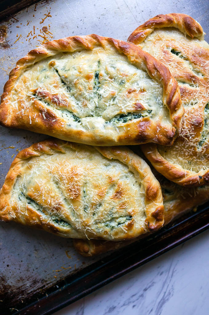 Ricotta and Spinach Calzones. A cheesy vegetarian calzone to substitute into your pizza routine! 