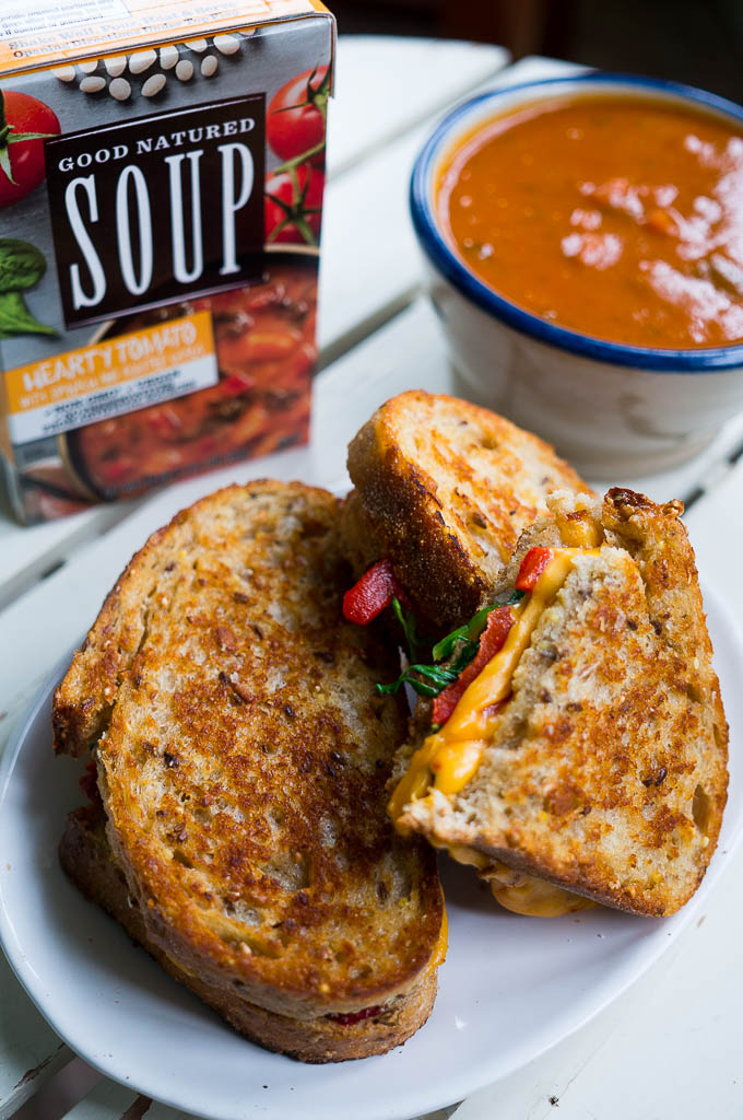 Spinach and Roasted Red Pepper Chipotle Grilled Cheese. Paired with Good Natured Hearty Tomato with Spinach and Roasted Garlic Soup, this favorite combo is a sure fire way to make your dinner table a happy place.