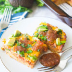 Migas Casserole is a twist on a traditional breakfast egg bake. Tortilla chips create the base and then it gets layered with bacon, salsa, eggs, and other goodies!