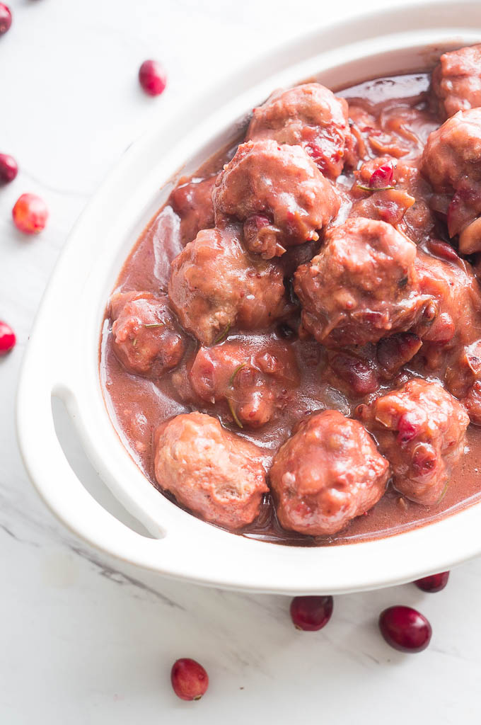 These Pressure Cooker Cranberry Balsamic Meatballs are the perfect appetizer for holiday entertaining. Pop one into your mouth and taste an explosion of cranberry, rosemary, and balsamic vinegar packed into one savory bite.