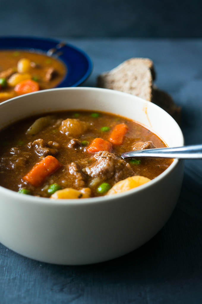 Pressure Cooker Hearty Beef Stew. A rich and hearty stick to your ribs kind of stew full of carrots, potatoes, green peas, and savory herbs.