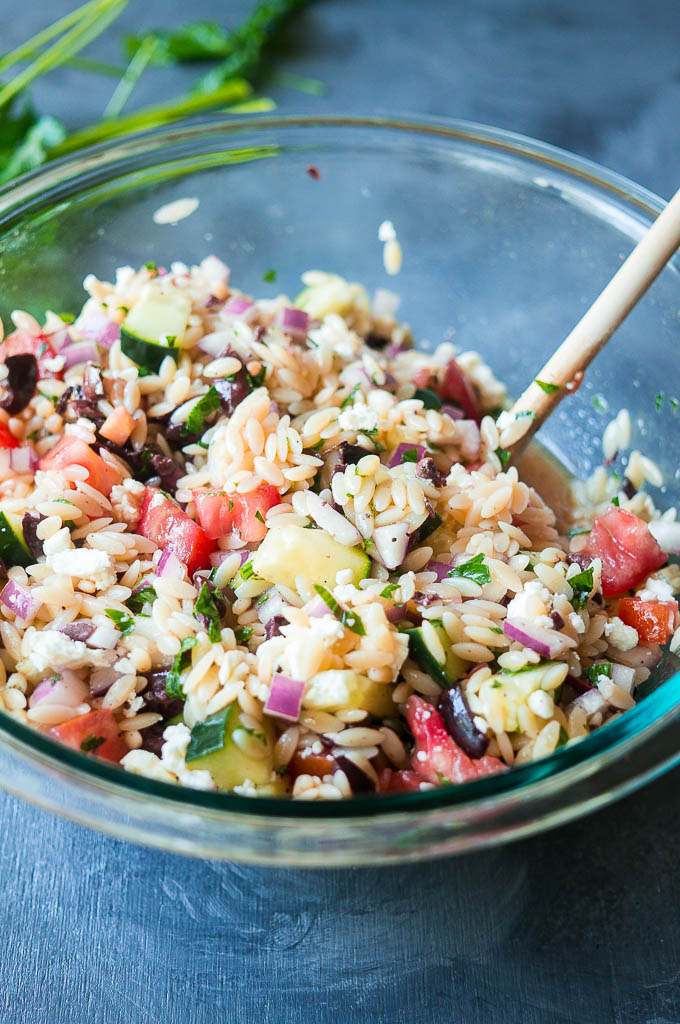 Greek Orzo Pasta Salad. Jump into spring with this fresh Greek flavored take on a traditional pasta salad!