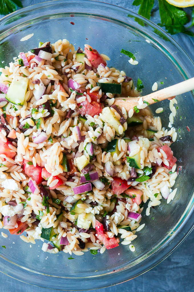 Greek Orzo Pasta Salad. Jump into spring with this fresh Greek flavored take on a traditional pasta salad!