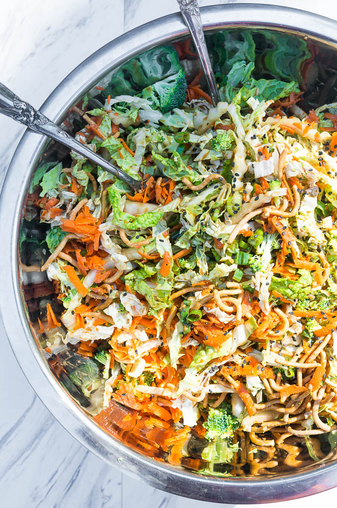 Crunchy Napa Cabbage Asian Slaw. A salad full of fresh and crunchy vegetables and drizzled with a creamy ginger soy dressing, this satisfying summer salad is a quick and easy go to!