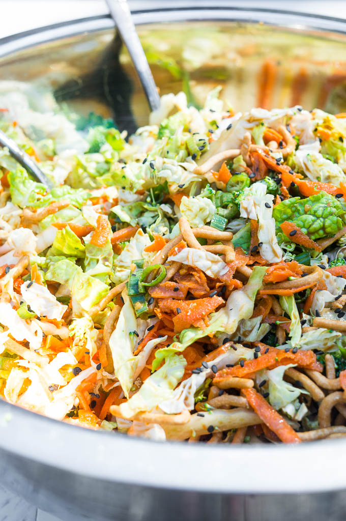 Crunchy Napa Cabbage Asian Slaw. A salad full of fresh and crunchy vegetables and drizzled with a creamy ginger soy dressing, this satisfying summer salad is a quick and easy go to!