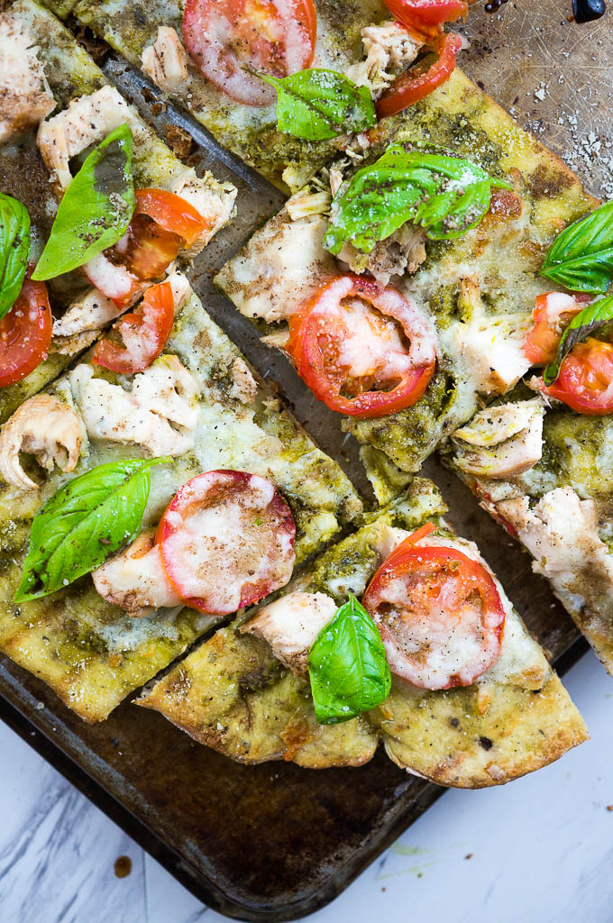 Caprese and Pesto Grilled Chicken Pizza is a fresh summer favorite guaranteed to be polished off in one sitting!
