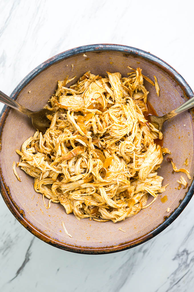 Pressure Cooker BBQ Pulled Chicken can be made with frozen chicken breasts and comes out completely tender in less than 20 minutes!