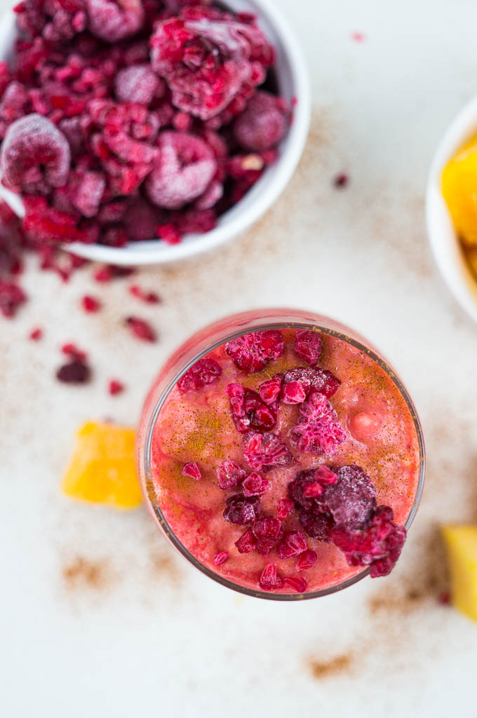 Wake up this hot summer day with a Raspberry Mango Smoothie full of frosty fruit, cinnamon, coconut milk, and a touch of honey.