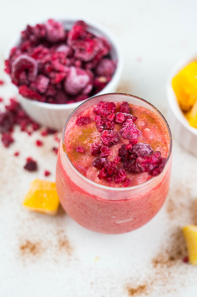 Wake up this hot summer day with a Raspberry Mango Smoothie full of frosty fruit, cinnamon, coconut milk, and a touch of honey.