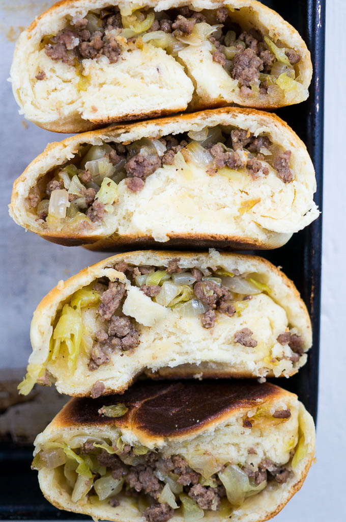 Nebraskan Runzas are a cornhusker state staple. A sweet dough wrapped around a simple ground beef, cabbage, and onion mixture - hometown comfort food at its finest!