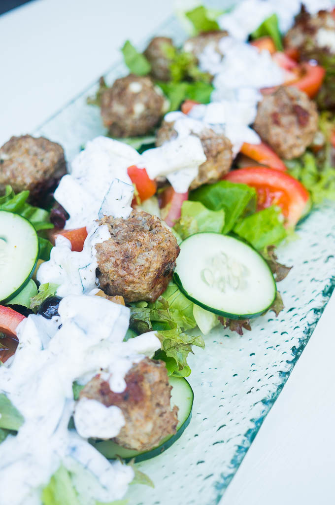 Impress your guests with these fancy pants Pressure Cooker Greek Lamb Meatballs with Salad and Tzatziki. The secret? It's 10X easier than it looks!!
