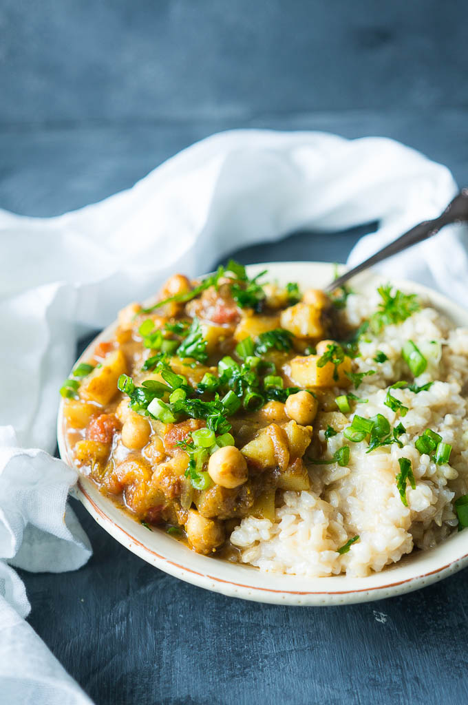 Pressure Cooker Chickpea and Potato Curry is a perfectly spiced meatless dinner that is made in under 30 minutes and can be served on a heaping pile of comforting and healthy brown or white rice.