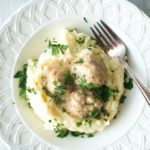 Pressure Cooker Swedish Turkey Meatballs served over creamy mashed potatoes is lean comfort food that feels like a guilty pleasure but is actually guilt-free!