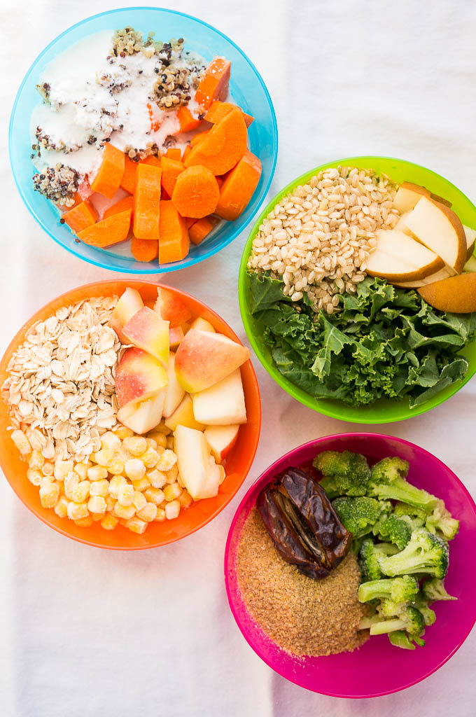 4 colorful dishes with baby food