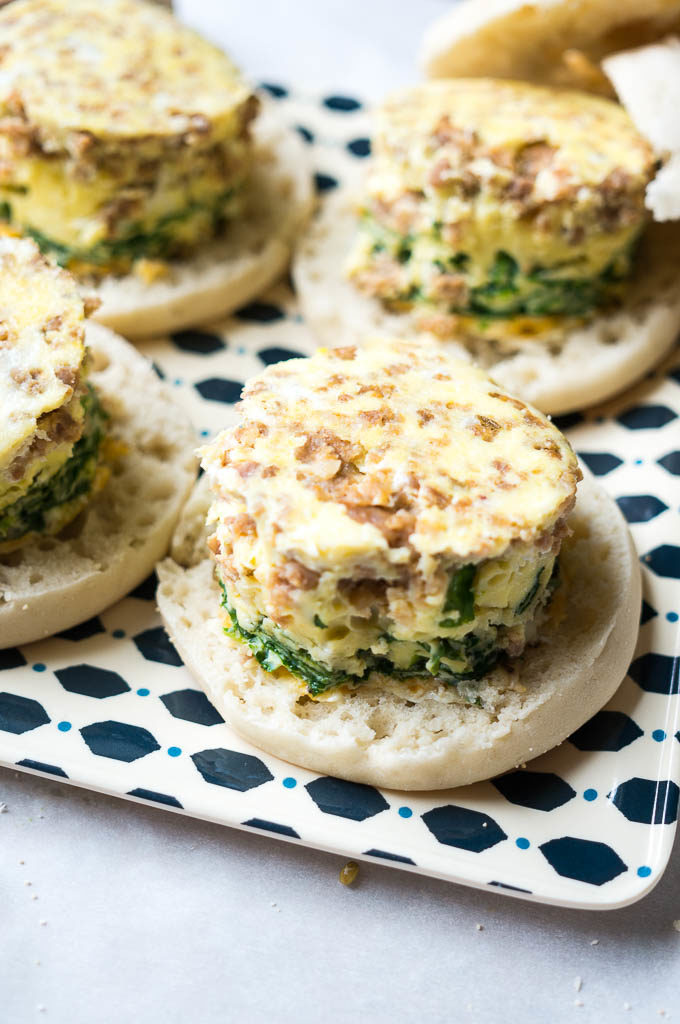 Egg and sausage breakfast sandwiches on an english muffin.