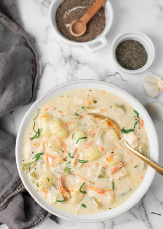 Creamy Chicken Soup in a white bowl on a marble background